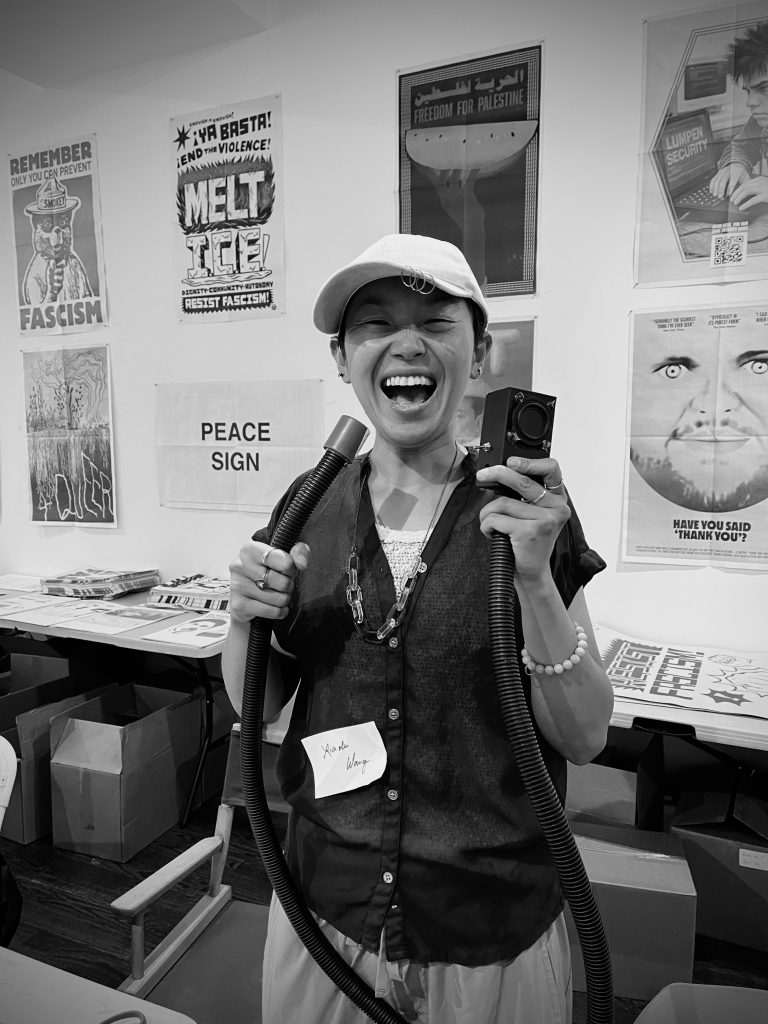 Black and white photos of workshop attendees with their sound instruments. Courtesy of Co-Prosperity.