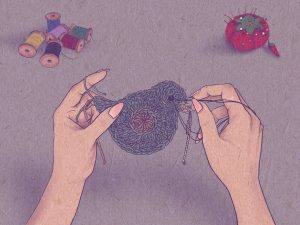 Image: An illustration of a close up on a pair of hands holding a crochet piece. Three loose ends of the yarn dangle in the person's left hand. In their right, they are threading a needle with deep purple thread through the piece. Six spools of thread and a tomato-shaped pin cushion pierced with multi-colored pins are scattered in the background. Illustration by summer mills.